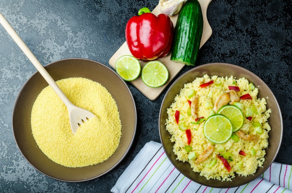 Couscous with grilled chicken meat and vegetables fresh lime on top